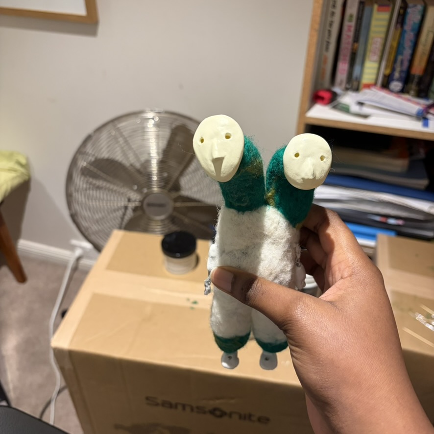 a stop motion puppet with two heads